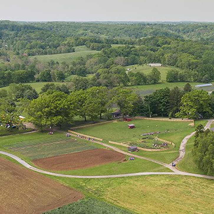 Aerial view of open fields and farm buildings at Coverdale Farm Preserve.